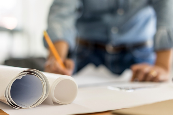 Photo of a person working on plans