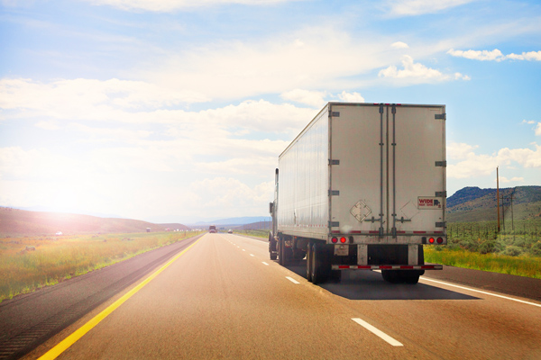 Photo of an 18-wheeler truck on the road