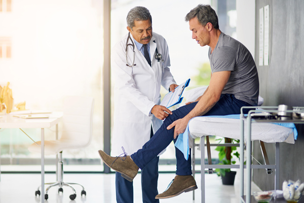 Photo of a doctor and patient during a routine checkup