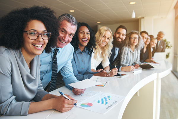 Photo of large group of happy business employees