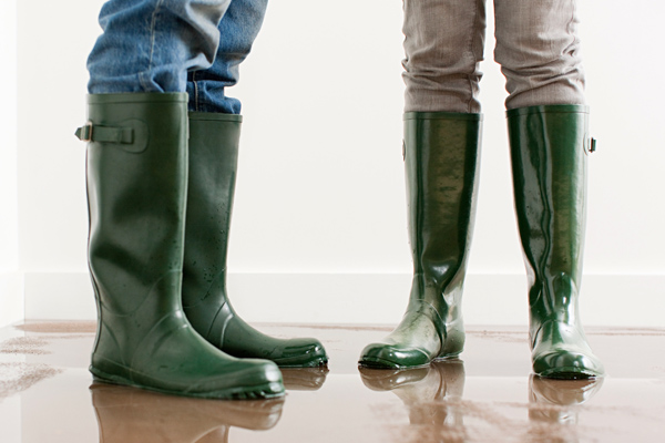 Photo of people wearing large galoshes or waterproof boots