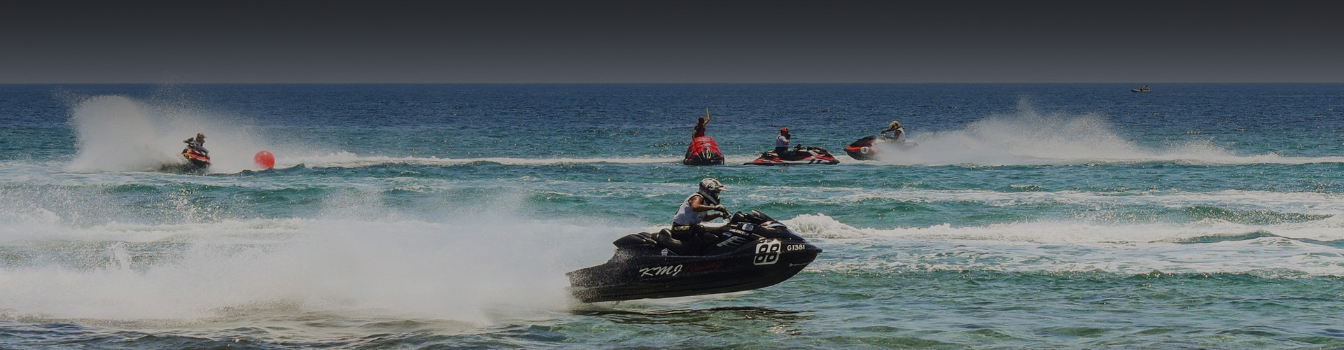 Photo of a person piloting a jet ski on the ocean