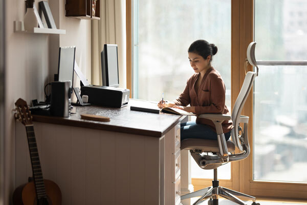 Photo of a woman working at a desk