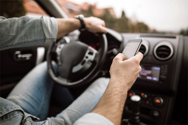 Blog Photo - A driver with hands on the wheel