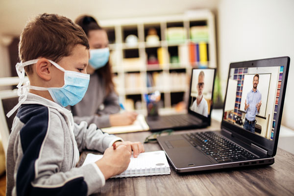 Children wearing masks working on latpops