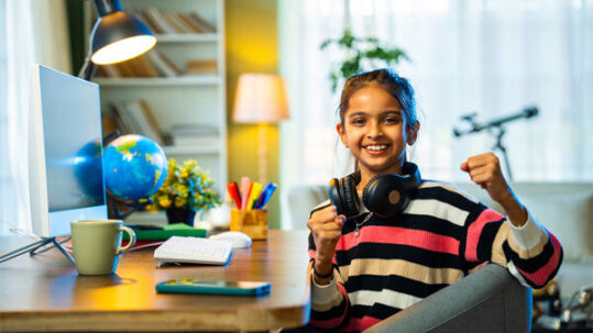 Image of a young girl at her home desk.