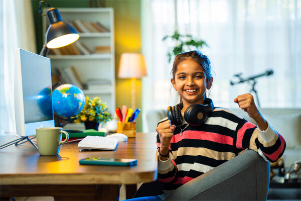 Image of a young girl at her home desk